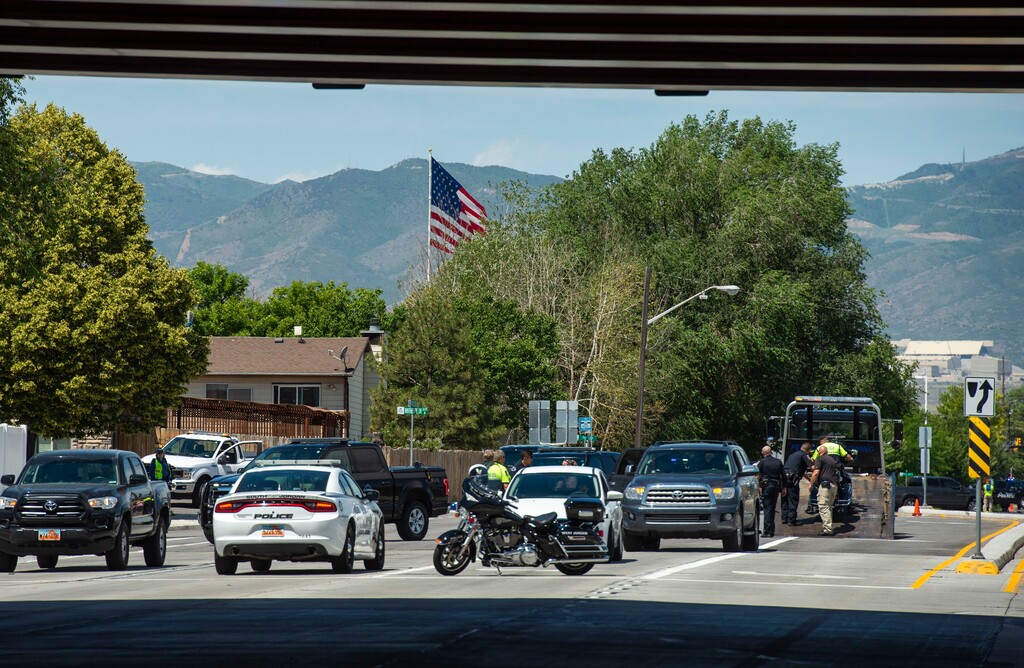 (Rick Egan  |  The Salt Lake Tribune)   Police investigate an accident on 9000 south, involving a West Jordan police officer on a motorcycle, and a car, which closed the East bound lanes of 9000 South, Wednesday, July 3, 2019.