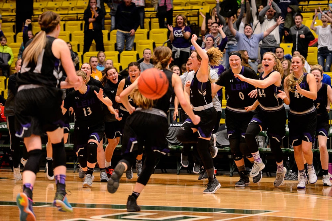 (Trent Nelson | The Salt Lake Tribune)  Lehi vs. Desert Hills, 4A State high school basketball tournament at Utah Valley University in Orem, Thursday March 1, 2018. Lehi players rush the court to celebrate their win.