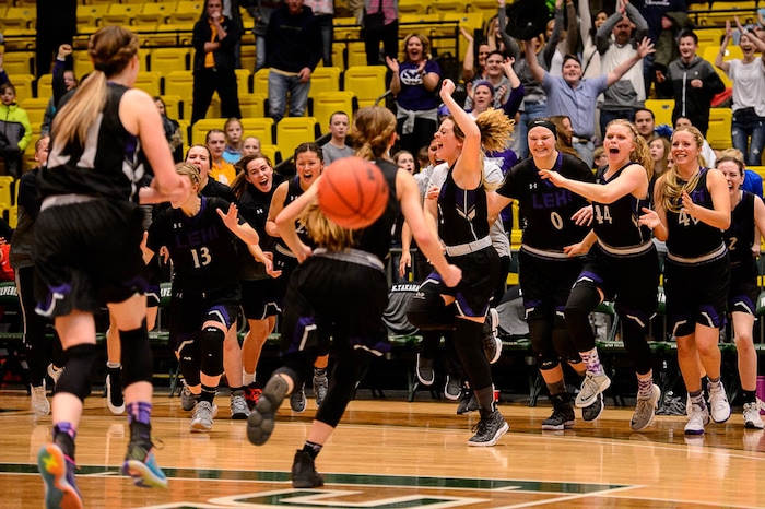 (Trent Nelson | The Salt Lake Tribune)
Lehi vs. Desert Hills, 4A State high school basketball tournament at Utah Valley University in Orem, Thursday March 1, 2018. Lehi players rush the court to celebrate their win.