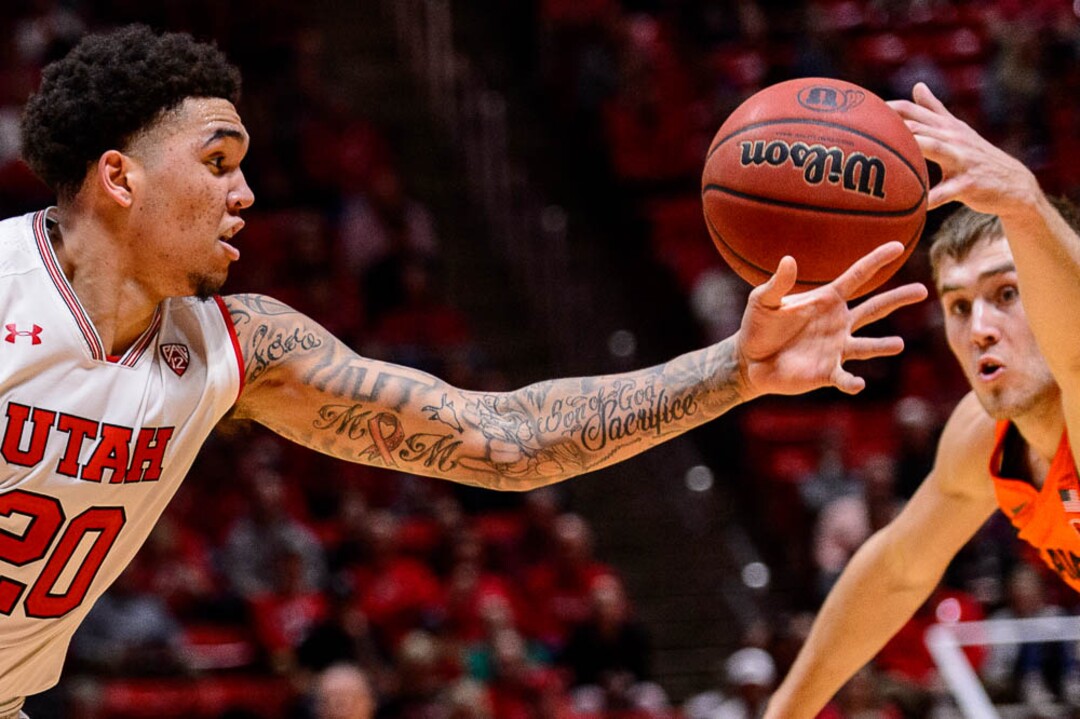 (Trent Nelson | The Salt Lake Tribune)  Utah Utes forward Timmy Allen (20) and Oregon State Beavers forward Tres Tinkle (3) reach for a loose ball as Utah hosts Oregon State, NCAA basketball in Salt Lake City on Saturday Feb. 2, 2019.
