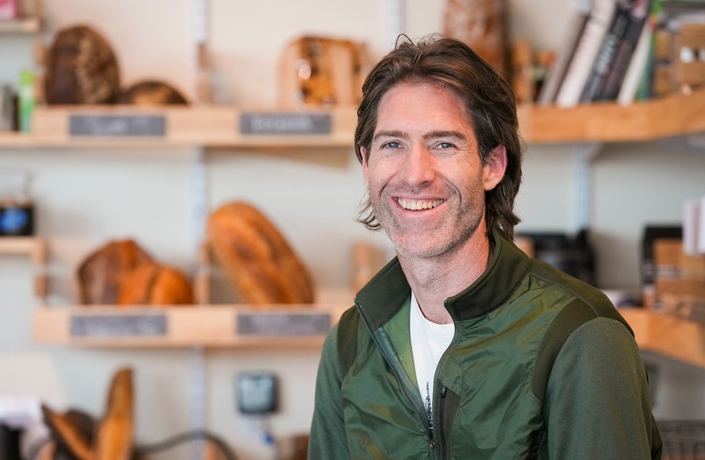 (Bethany Baker  |  The Salt Lake Tribune) Todd Bradley, the owner of Leavity Bread and Coffee, leans on his counter at his coffee shop in Salt Lake City on Friday, March 28, 2025.