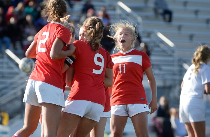 (Scott Sommerdorf   |  The Salt Lake Tribune)   East's Sami Black, right, celebrates Emily Jensen's goal to give East a 1-0 lead during first half play. East beat Corner Canyon 4-1 in a Class 5A girls' soccer state quarterfinal, Thursday, October 12, 2017. 