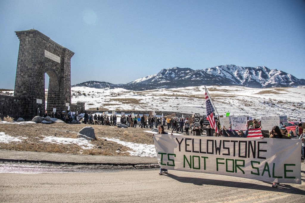 (Erin Trieb | The New York Times) People protest federal government layoffs at Yellowstone National Park in Gardiner, Mont., on March 1, 2025.