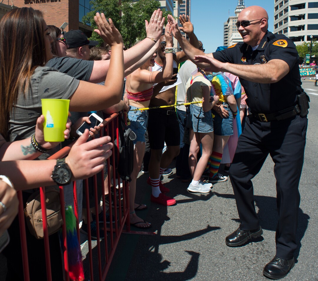 (Rick Egan  |  The Salt Lake Tribune)    Salt Lake Police Chief Mike Brown, high- fives parade goers as he walks in the Utah Pride Parade,  in Salt Lake City, Sunday, June 3, 2018.