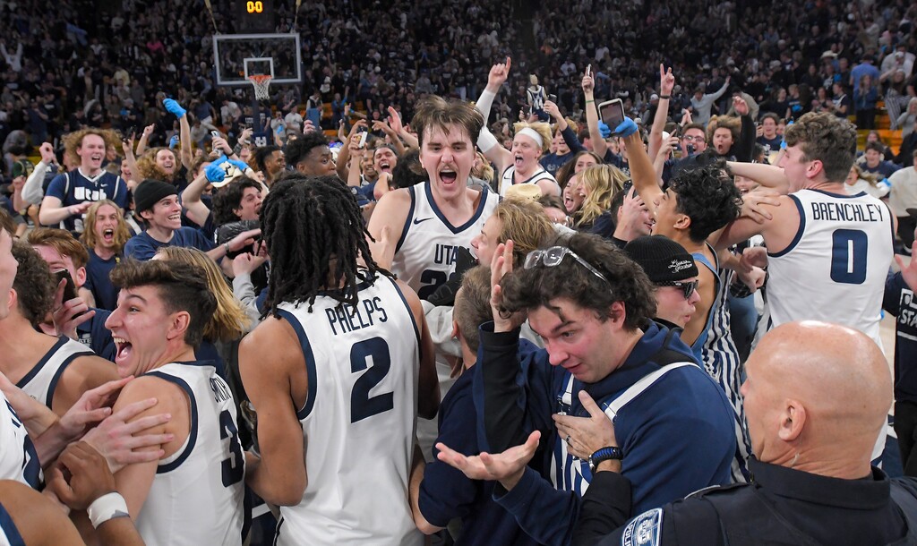 Utah State players celebrate with fans after defeating Colorado State in an NCAA college basketball game Saturday, Jan. 6, 2024, in Logan, Utah. (Eli Lucero/Herald Journal)