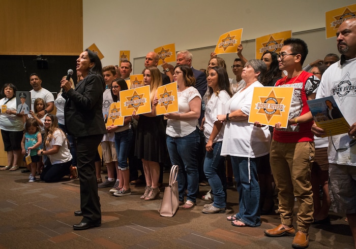 (Rick Egan  |  The Salt Lake Tribune)  Rosie Rivera gives a second speech Saturday, Aug. 12, 2017, before the final vote for the next Salt Lake County sheriff. Fellow candidates Levi Hughes, Fred Ross, Ken Hansen — who lost in the previous round — support her with signs.