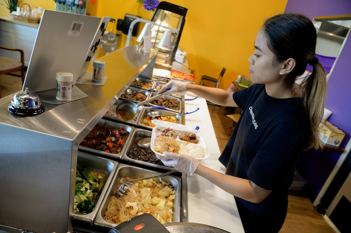 (Francisco Kjolseth  |  The Salt Lake Tribune)  BFF Turon, a new Filipino restaurant in West Jordan serves up turo-turo or cafeteria style food as Arlene Orani prepares a lunch special during a recent lunch hour.