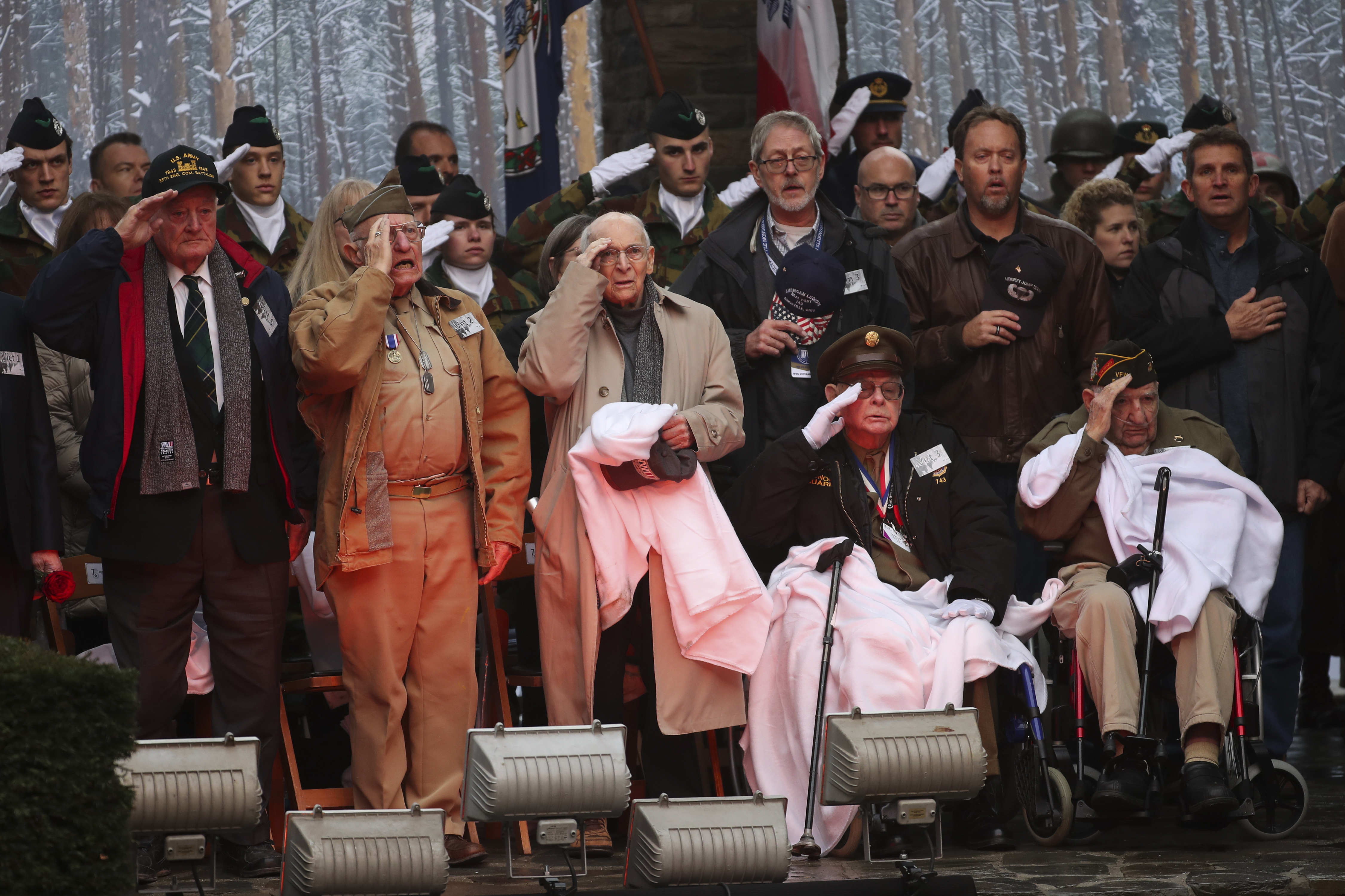 (Francisco Seco | AP) U.S. Battle of the Bulge veterans, front row, listen to the U.S. national anthem during a ceremony to commemorate the 75th anniversary of the Battle of the Bulge at the Mardasson Memorial in Bastogne, Belgium on Monday, Dec. 16, 2019. The Battle of the Bulge, also called Battle of the Ardennes, took place between Dec. 1944 and Jan. 1945 and was the last major German offensive on the Western Front during World War II.