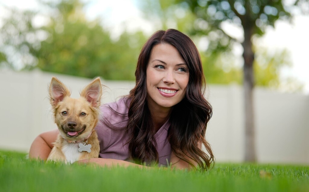 (Francisco Kjolseth | The Salt Lake Tribune) Ashley England of Clinton spends time with her 1-year-old puppy, Suki on Wednesday, Sept. 3, 2025. England purchased Suki in November from the homeowner in the Avenues, where more than 100 dogs were recently rescued from unsanitary living conditions. At the time of the sale, Suki was infected with canine parvovirus.