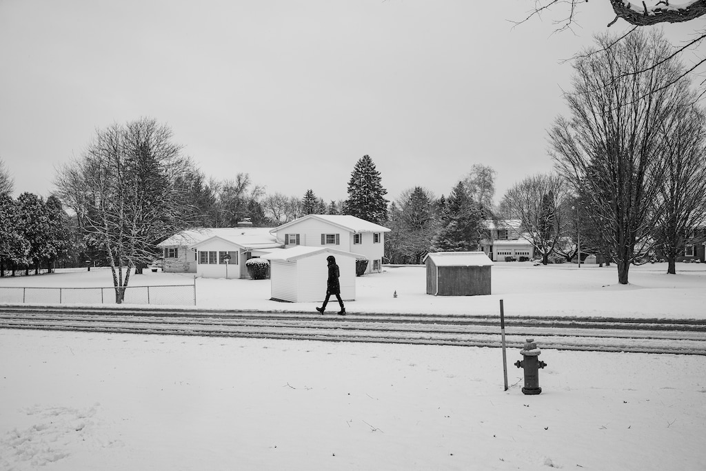(Damon Winter | The New York Times)
A person takes a solitary walk after a snowstorm in Cortland, N.Y., on March 23. "We might be as ill prepared for the mental toll of the pandemic as we were for its physical toll," writes New York Times opinion columnist Farhad Manjoo.