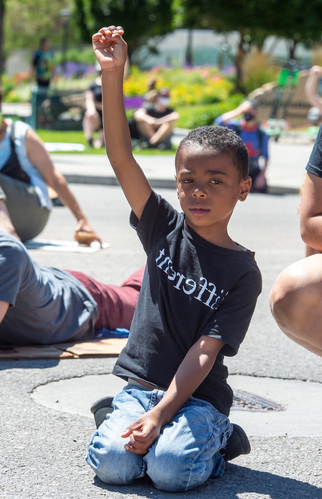 (Rick Egan  |  The Salt Lake Tribune)  Anthony Clary kneels with the marchers archers as they read a list of black people that have been killed by the police, during a Juneteenth march in the streets of Salt Lake City, Friday, June 19, 2020.