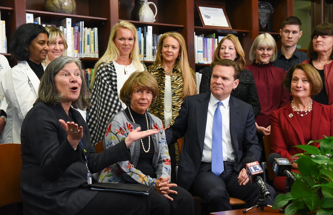 (Francisco Kjolseth  |  The Salt Lake Tribune)  Surrounded by clinicians, researchers and staff, Mary Beckerle, CEO of the Huntsman Cancer Institute, Karen Huntsman, chairwoman of the Huntsman Foundation, Peter Huntsman, chairman and CEO of the Huntsman Cancer Foundation, and Ruth Watkins, president of the University of Utah, from left to right, smile as the Huntsman family announces a $30 million donation to the institute on Friday, Jan. 11, 2019.