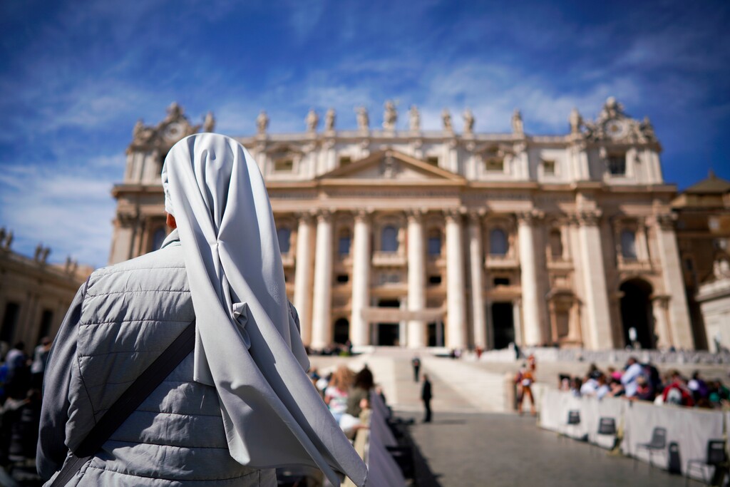 (AP Photo/Andrew Medichini, file) In this Wednesday, Sept. 26, 2018, file photo, a nun waits for the arrival of Pope Francis for his weekly general audience, in St. Peter's Square at the Vatican.
