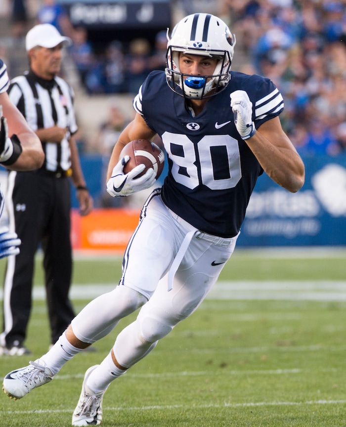 (Rick Egan  |  The Salt Lake Tribune)    Brigham Young wide receiver Gunner Romney (80) runs the ball for the Cougars,  in football action Brigham Young Cougars vs McNeese State Cowboys at Lavell Edwards Stadium, Saturday, Sept. 22, 2018.


