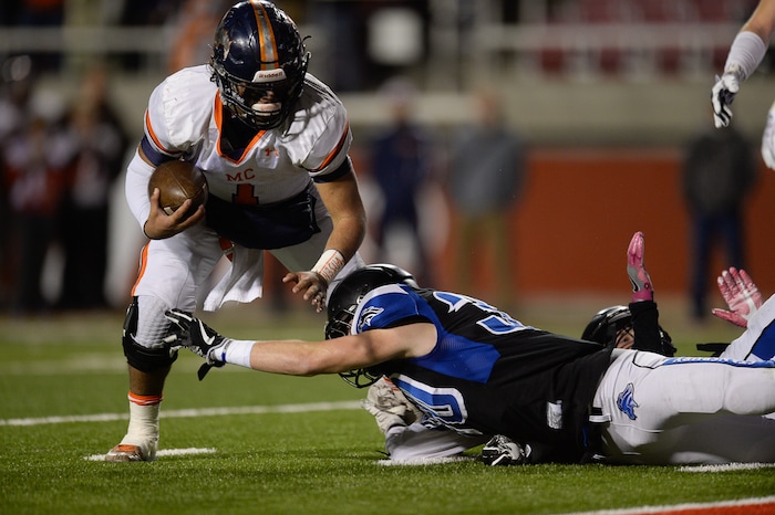 (Francisco Kjolseth  |  The Salt Lake Tribune)  Quarterback Brady Hall of Mountain Crest eyes the end zone guarded by Stansbury in their class 4A semifinal game at Rice-Eccles Stadium, Thursday, Nov. 9, 2017.