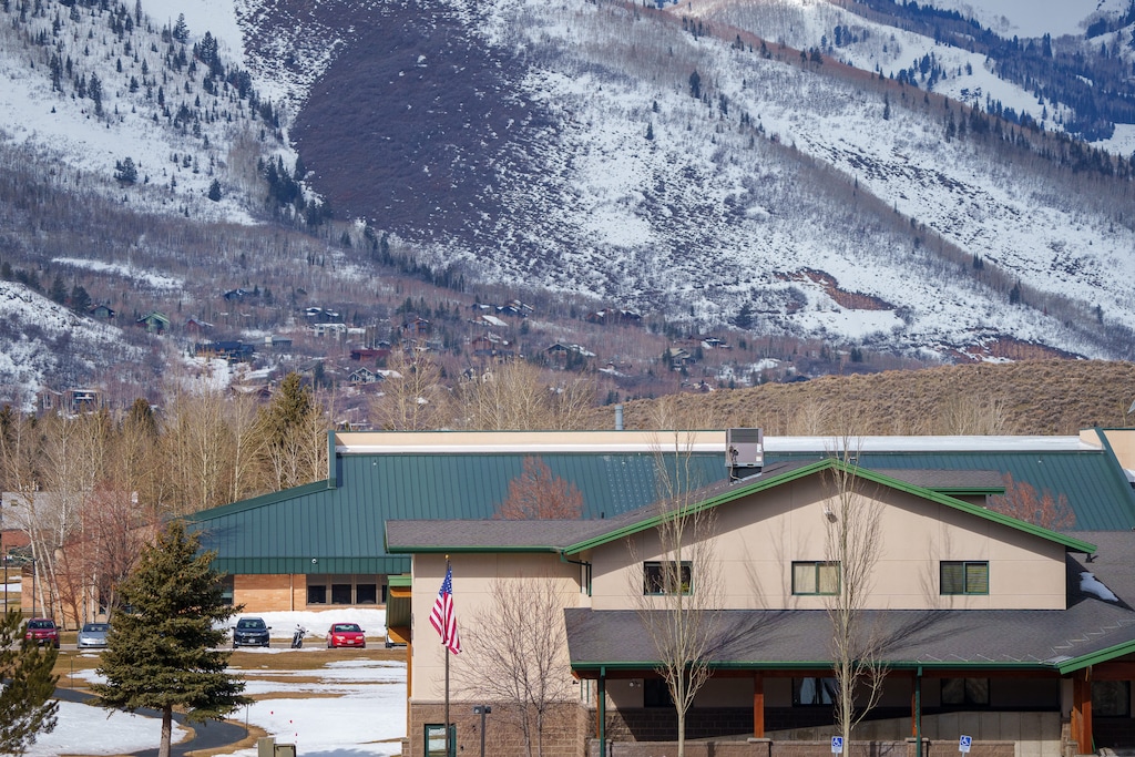 (Trent Nelson | The Salt Lake Tribune) The Park City School District offices, front, and Treasure Mountain Middle School in Park City on Tuesday, March 22, 2022. Utah’s highest-paid superintendent, Jill Gildea of the Park City School District, has announced plans to retire.