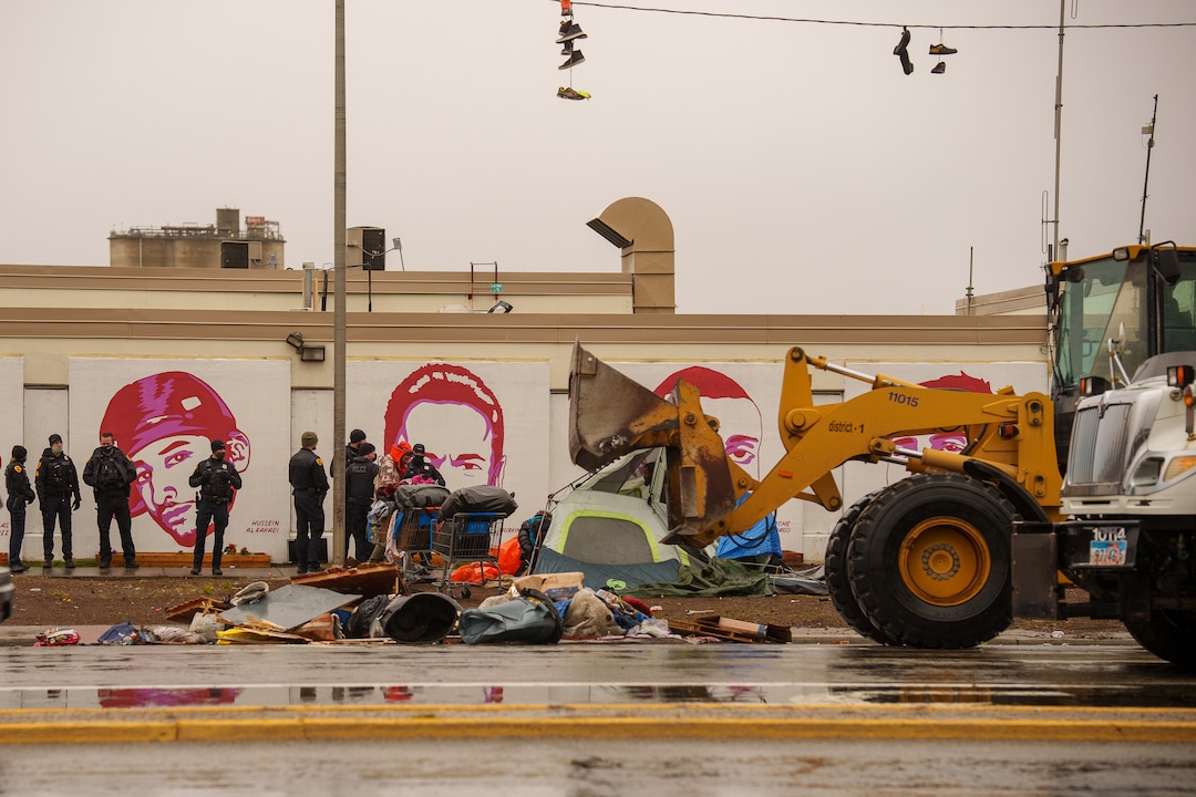 (Trent Nelson  |  The Salt Lake Tribune) Salt Lake County conducts a camp cleanup at the Fleet Block Murals in Salt Lake City on Wednesday, April 14, 2021.