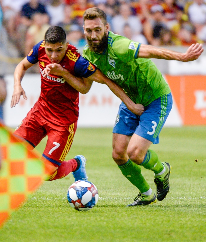 (Leah Hogsten  |  The Salt Lake Tribune) Real Salt Lake forward Jefferson Savarino (7) battles Seattle Sounders defender Jonathan Campbell (3) as Real Salt Lake hosts the Seattle Sounders, Aug. 14, 2019, at Rio Tinto Stadium in Sandy.