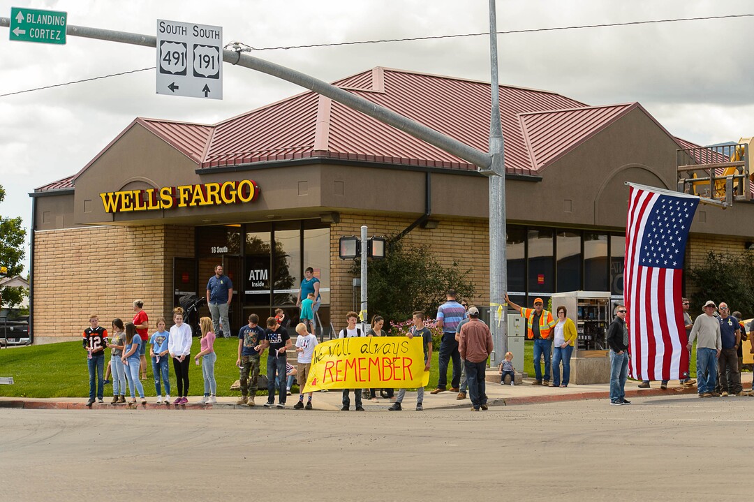 (Trent Nelson | The Salt Lake Tribune)  Crowds line Main Street in Monticello to honor the motorcade of fallen soldier Aaron Butler, who was killed last week in Afghanistan, , Thursday August 24, 2017.