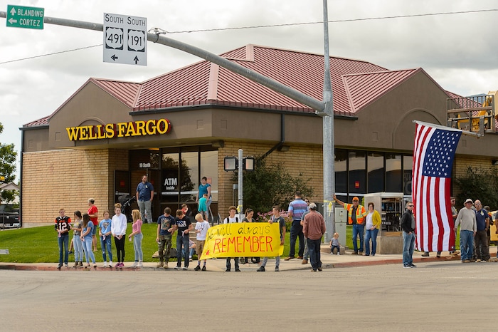 (Trent Nelson | The Salt Lake Tribune)  Crowds line Main Street in Monticello to honor the motorcade of fallen soldier Aaron Butler, who was killed last week in Afghanistan, , Thursday August 24, 2017.