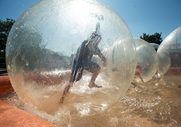 (Rick Egan  |  The Salt Lake Tribune)   Tesla Thomas, 9 of American Fork, rested in side a giant plastic bubble, at the Utah State Fair, Sunday, September 10, 2017.


