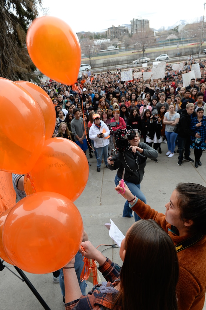 (Francisco Kjolseth  |  The Salt Lake Tribune)  Balloons representing the 17 killed in last month's mass shooting at Marjory Stoneman Douglas High School in Parkland, Fla., are released by West High School students in Salt Lake, during a student walkout on Wed. March 14, 2018. Students in Utah and around the country planned the large-scale coordinated demonstration to protest gun violence. 