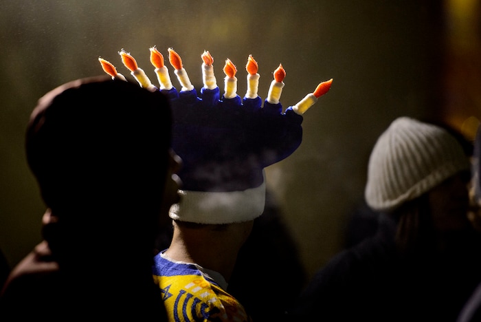 (Steve Griffin  |  The Salt Lake Tribune) The public joined  Rabbi Benny Zippel of Chabad Lubavitch as he lights a giant menorah for the first night of Hanukkah, the Jewish eight day festival of lights outside, Abravanel Hall in Salt Lake City Tuesday December 12, 2017.