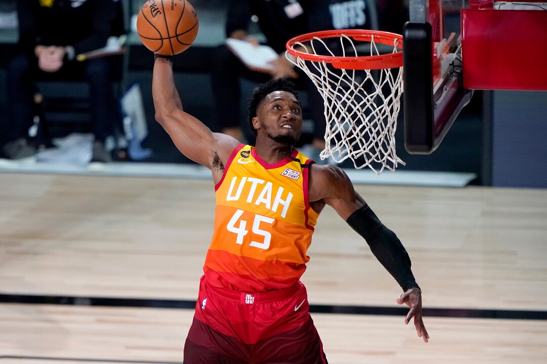 (Ashley Landis | AP) Utah Jazz's Donovan Mitchell (45) dunks against the Denver Nuggets during the second half of an NBA basketball first round playoff game Friday, Aug. 21, 2020, in Lake Buena Vista, Fla.