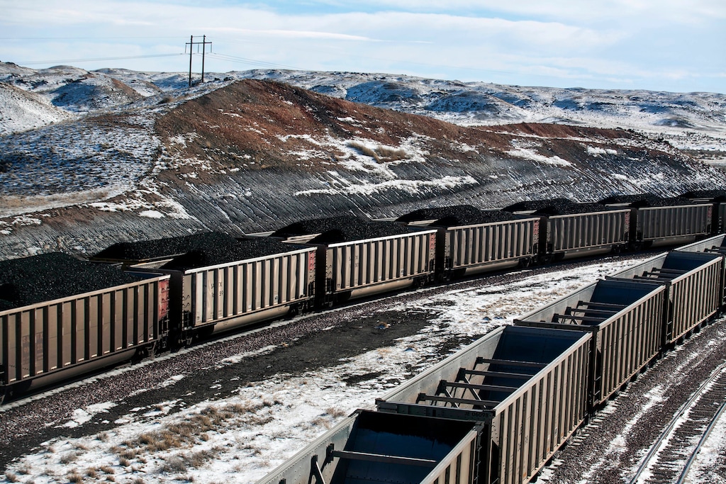 (Ryan Dorgan | The Casper Star-Tribune | AP file photo) In this Jan. 9, 2014, file photo, rail cars are filled with coal and sprayed with a topper agent to suppress dust at Cloud Peak Energy's Antelope Mine north of Douglas, Wyo. The Navajo Nation will not financially back bonds a tribal energy company needs for a trio of newly acquired coal mines off the reservation, the tribal president said Tuesday, Nov. 12, 2019, explaining that it's too risky and his administration wants the company to move away from coal. The Navajo Transitional Energy Co. recently bought Montana's largest coal mine and two mines in Wyoming at auction after Cloud Peak Energy declared bankruptcy.