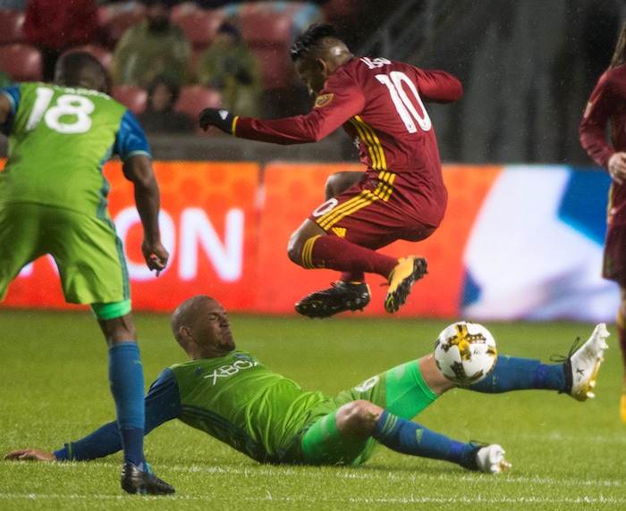 (Rick Egan  |  The Salt Lake Tribune)  Real Salt Lake forward Joao Plata (10) leaps over Seattle Sounders midfielder Osvaldo Alonso (6), as he goes for the ball, in MLS soccer action, Real Salt Lake vs Seattle Sounders, in Sandy, Utah, Saturday, September 23, 2017.