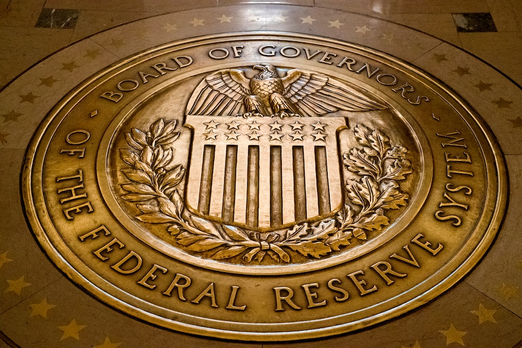 FILE- In this Feb. 5, 2018, file photo, the seal of the Board of Governors of the United States Federal Reserve System is displayed in the ground at the Marriner S. Eccles Federal Reserve Board Building in Washington.  (AP Photo/Andrew Harnik, File)