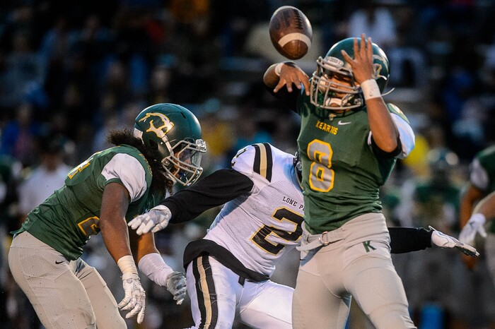 (Trent Nelson | The Salt Lake Tribune) Kearn's Audrick Afatasi moves in for the interception as Lone Peak's Brigham Trowbridge can't hold on to the pass as Kearns hosts Lone Peak, high school football, Thursday September 14, 2017.