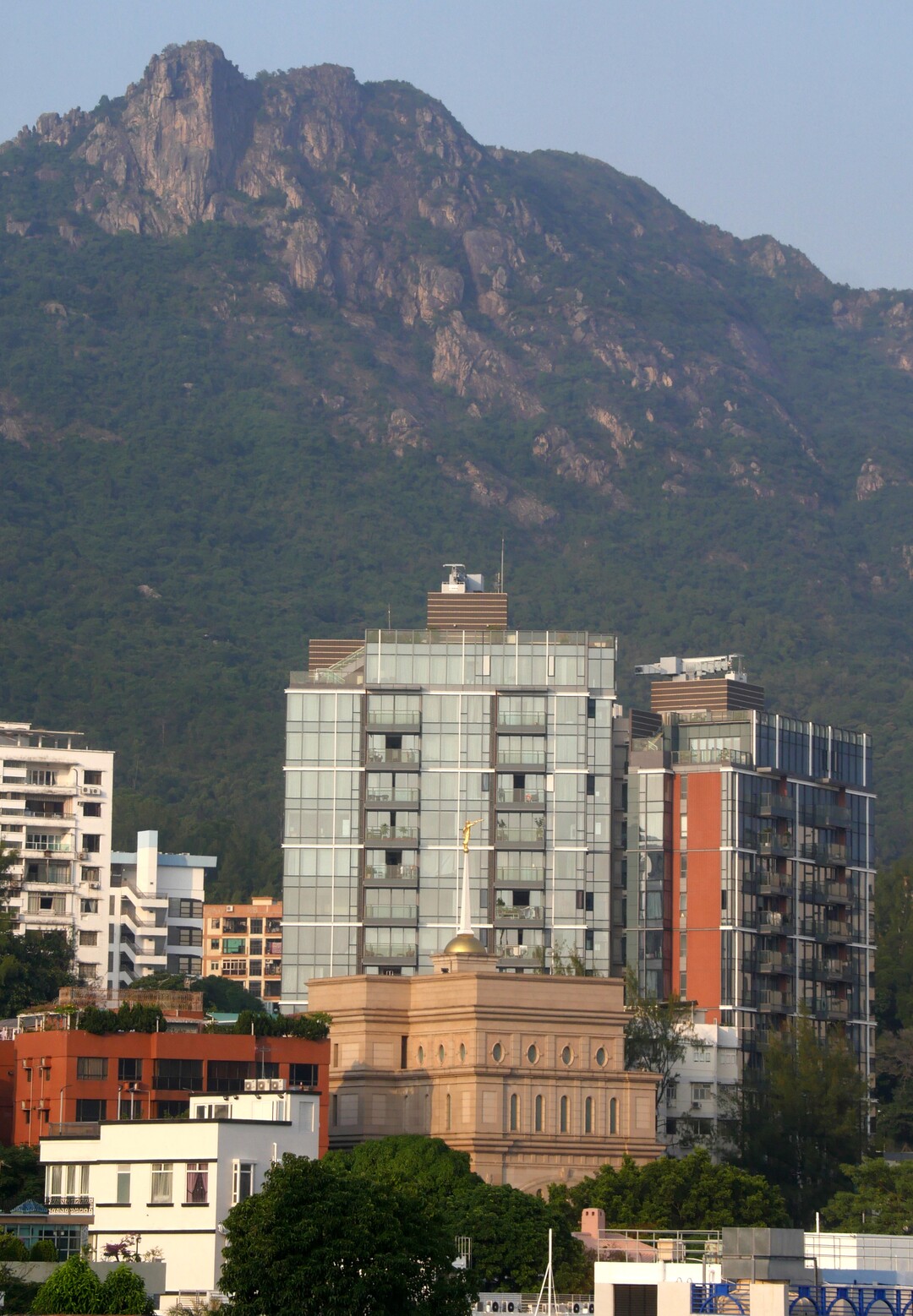 (Mike Stack  |  for The Salt Lake Tribune) LDS Temple in Kowloon District with Lion Rock in the background.
