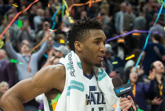 (Rick Egan  |  The Salt Lake Tribune)  Utah Jazz guard Donovan Mitchell (45) gives an interview as the confetti flies, after  Jazz defeated the Spurs 101-99, in NBA action in Salt Lake City, Monday, February 12, 2018.