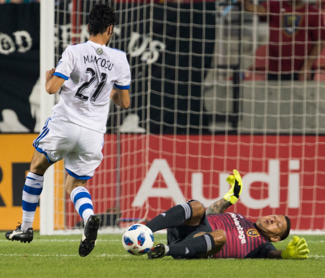 (Rick Egan  |  The Salt Lake Tribune)     Real Salt Lake goalkeeper Nick Rimando (18) sides in and blocks a kick by Montreal Impact forward Matteo Mancosu (21), in MLS action between Real Salt Lake and Montreal Impact, at Rio Tinto Stadium in Sandy, Saturday, Aug. 11, 2018.