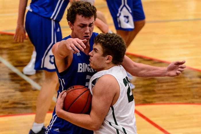 (Trent Nelson | The Salt Lake Tribune)  Olympus's Harrison Creer runs into Bingham's Brock Anderson as Olympus faces Bingham, high school boys' basketball at the Utah Elite 8 tournament in American Fork, Thursday December 7, 2017.