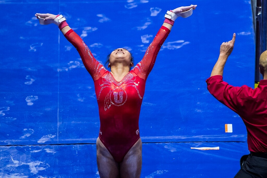 (Chris Detrick  |  The Salt Lake Tribune)  Utah's Kim Tessen competes on the bars during the gymnastics meet against Brigham Young University Friday, January 5, 2018.  