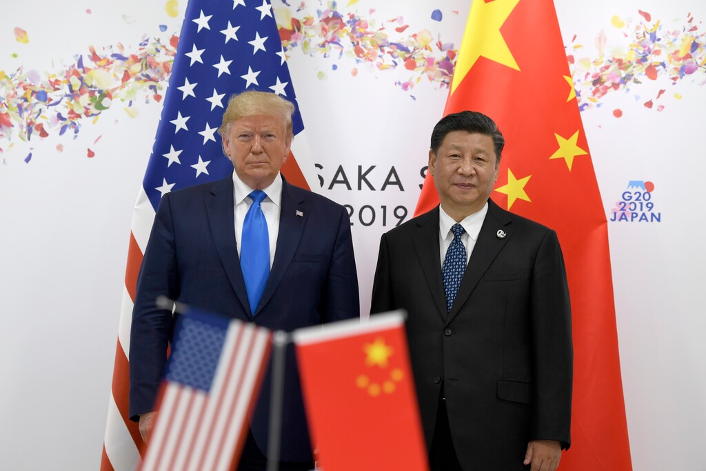 FILE - In this June 29, 2019, file photo President Donald Trump, left, poses for a photo with Chinese President Xi Jinping during a meeting on the sidelines of the G-20 summit in Osaka, Japan. (AP Photo/Susan Walsh, File)