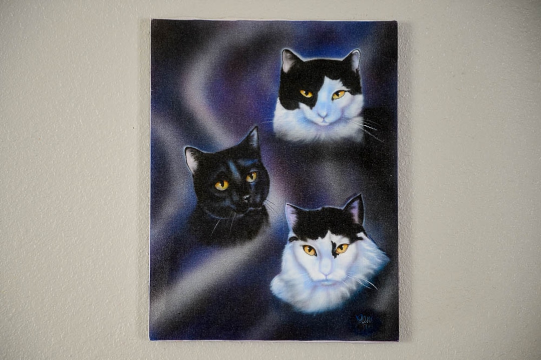 (Trent Nelson | The Salt Lake Tribune)  A painting in Jim Vesock's West Valley City home depicting three of his previous cats, on Wednesday March 13, 2019.