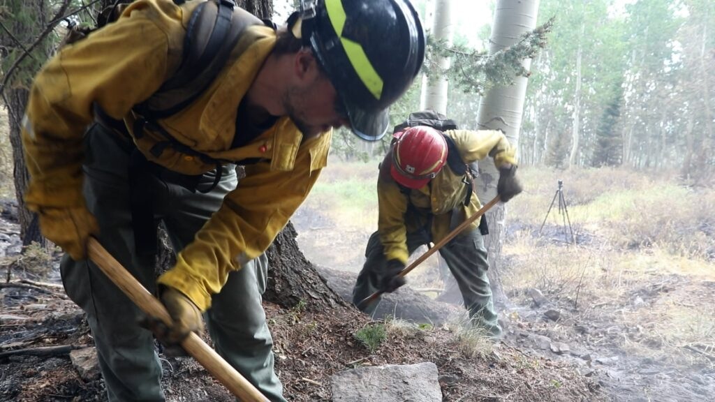 (U.S. Forest Service) Firefighters conduct mop-up operations on the eastern side of the Babylon Fire on July 17. All evacuation notifications were lifted Monday as the 107,189-acre wildfire reached 95% containment.