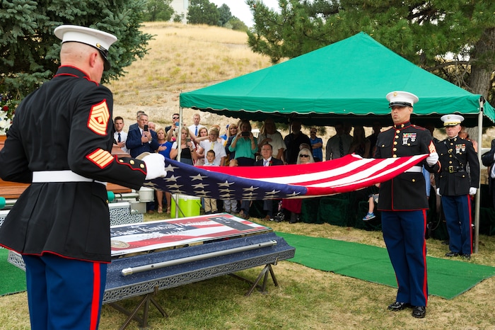 (Alex Gallivan  |  Special to The Tribune) Marine Pfc. Robert K. Holmes, who died 77 years ago aboard the USS Oklahoma during the attack on Pearl Harbor, is laid to rest in the Salt Lake City Cemetery, Monday, Aug. 20, 2018.