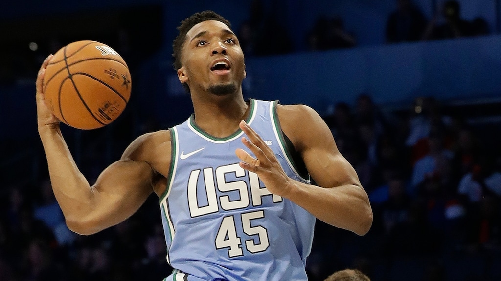 U.S. Team's Donovan Mitchell, of the Utah Jazz moves to the hoop against World Team's, Bogdan Bogdanovic, of the Sacramento Kings during the NBA All-Star Rising Stars basketball game, Friday, Feb. 15, 2019, in Charlotte, N.C. (AP Photo/Chuck Burton)