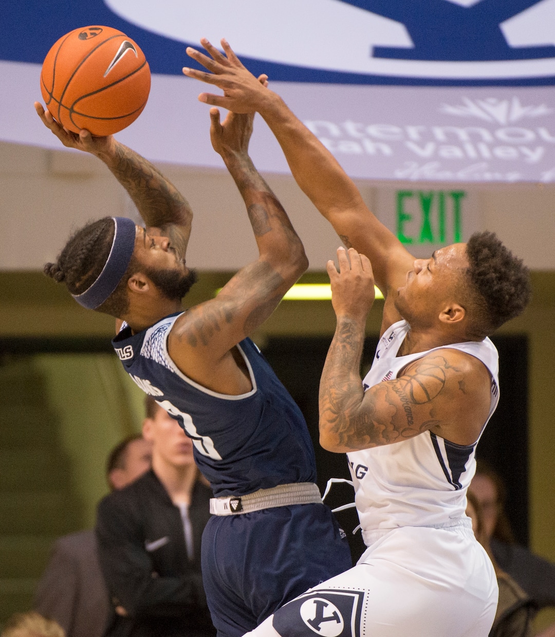 (Rick Egan  |  The Salt Lake Tribune)   Rice Owls guard Ako Adams (3) shoots over Brigham Young Cougars guard Jahshire Hardnett (0), in basketball action between Brigham Young Cougars and Rice Owls, at the Marriott Center in Provo, Wednesday, Nov. 21, 2018.