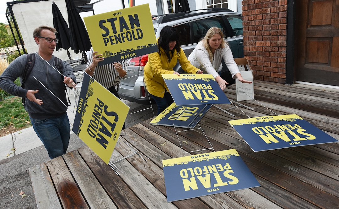 (Francisco Kjolseth  |  The Salt Lake Tribune)  Staff and volunteers assemble signs for former Salt Lake City Councilman Stan Penfold as he gets ready to announce his bid for mayor surrounded by supporters in the 9th East and 9th South area on Thursday, Oct. 4, 2018.