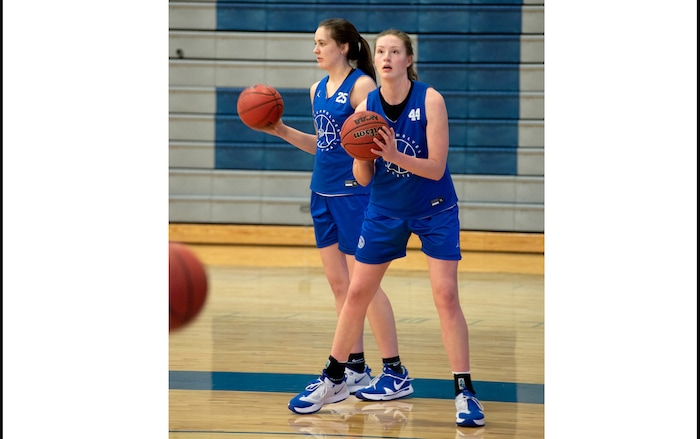 (Francisco Kjolseth  | The Salt Lake Tribune) Fremont girls basketball players Emma Calvert, left, and Maggie Mendelson listen to instruction during a recent practice. The team is a top 15 program in the country, per MaxPreps, and is led by 3 highly recruited girls including Calvert and Mendelson.