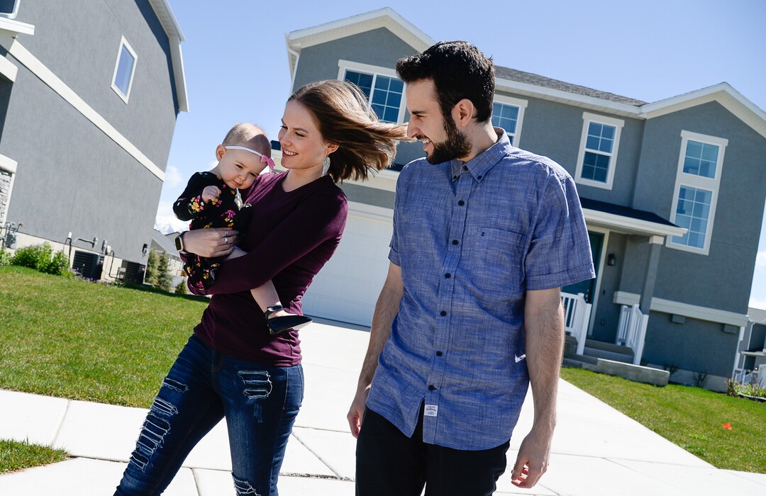 (Francisco Kjolseth  |  The Salt Lake Tribune)  Ember and Jeremy Ulrich take their daughter Jemma, 1, for a walk around their newly developed neighborhood in Lehi after moving there from Pleasant Grove last October. Along with some friends who were also looking to get more house for their money and ended up moving in next door, Jeremy wanted to be closer to his job at Adobe in Lehi.