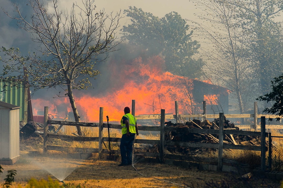 (Trent Nelson | The Salt Lake Tribune)  A structure burns in South Weber, Tuesday September 5, 2017.