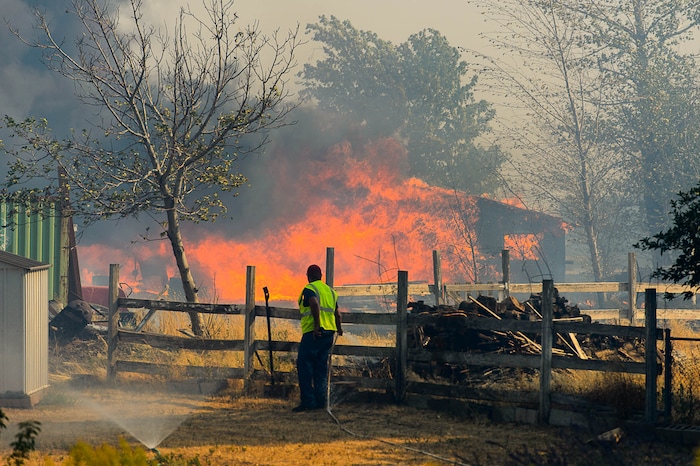 (Trent Nelson | The Salt Lake Tribune)  A structure burns in South Weber, Tuesday September 5, 2017.