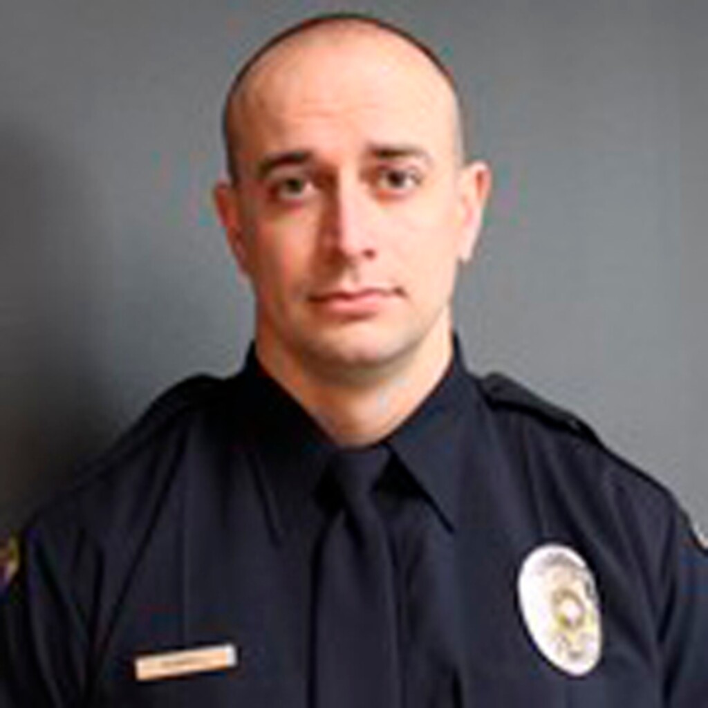 (South Salt Lake Police Department) This photo provided by the South Salt Lake Police Department shows officer David Romrell. Romrell died Saturday, Nov. 24, 2018 after being struck by a vehicle driven by a fleeing burglary suspect. The suspect was shot and killed by officers at the scene.