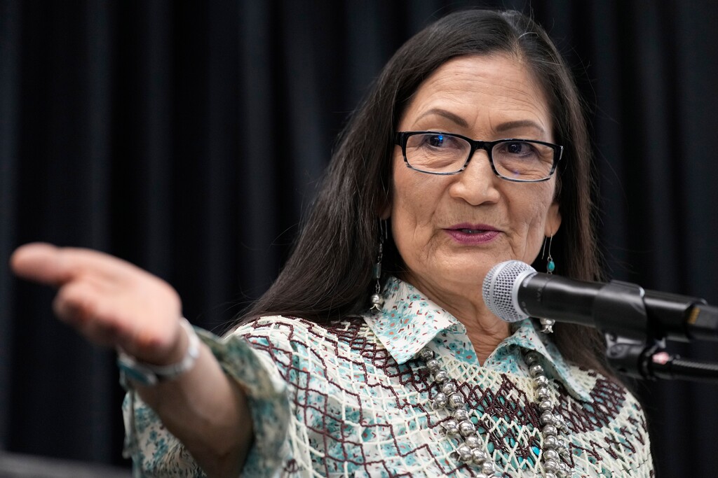 FILE - Interior Secretary Deb Haaland speaks at an event to celebrate the designation of the Avi Kwa Ame National Monument in April 2023, in Las Vegas, as the Interior Department announced a partnership with the National Endowment for the Humanities to document the experiences of thousands of Native American, Alaska Native and Native Hawaiian students at federally funded schools across the country. (AP Photo/John Locher, File)